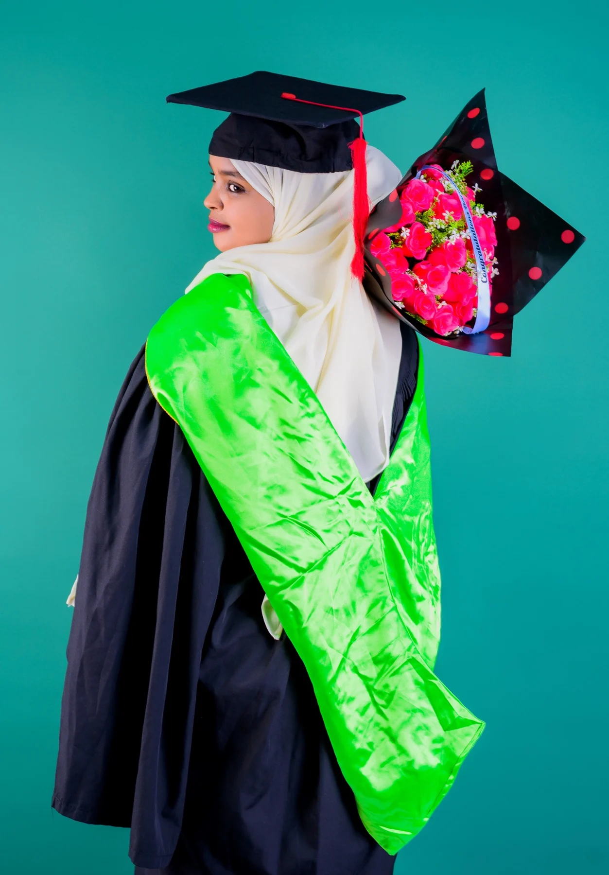 Graduation portrait with bouquet by PK Studios